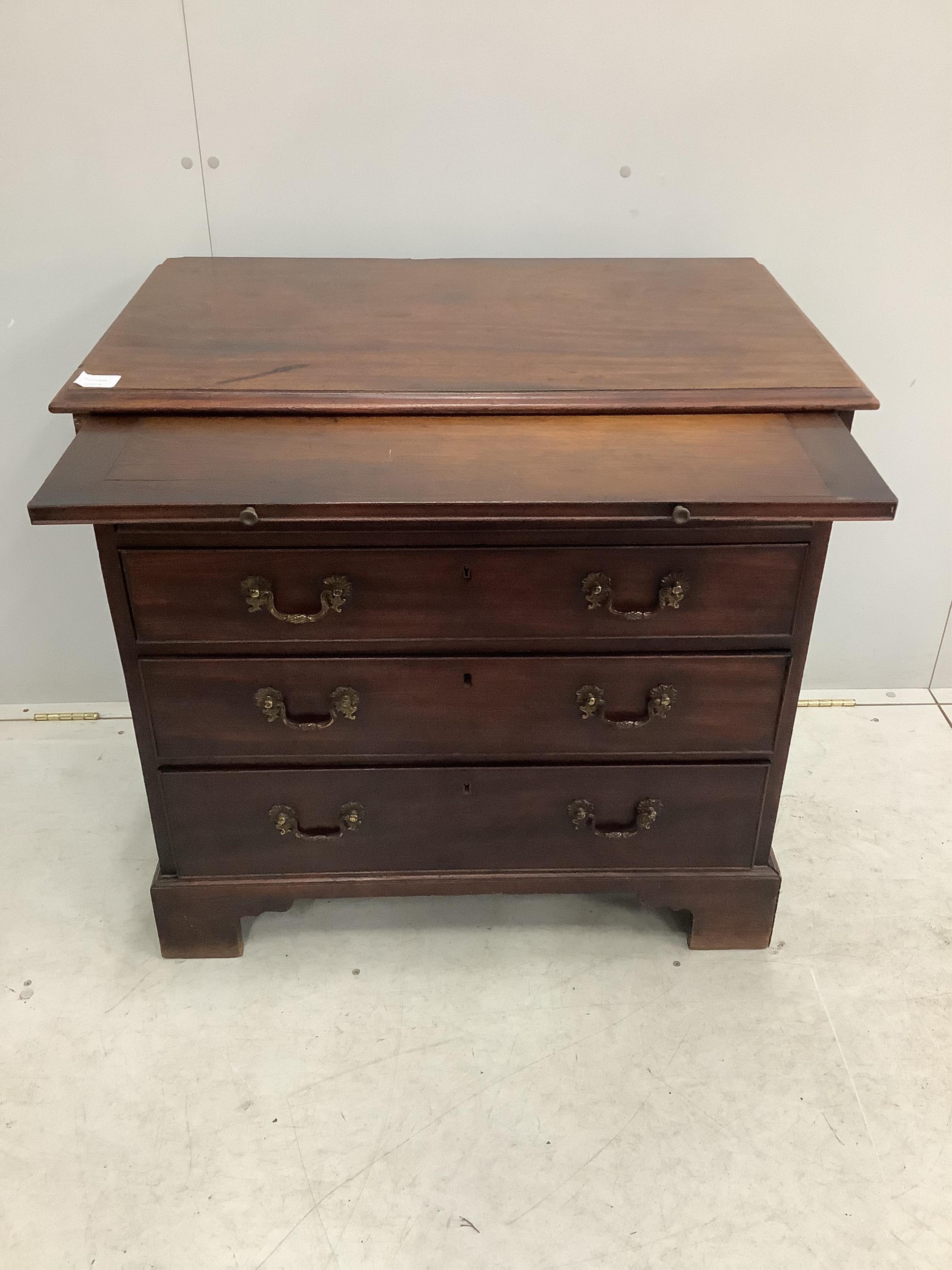 A George III mahogany chest with brushing slide, width 83cm, depth 51cm, height 81cm. Condition - fair